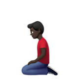 uomo inginocchiato: carnagione scura